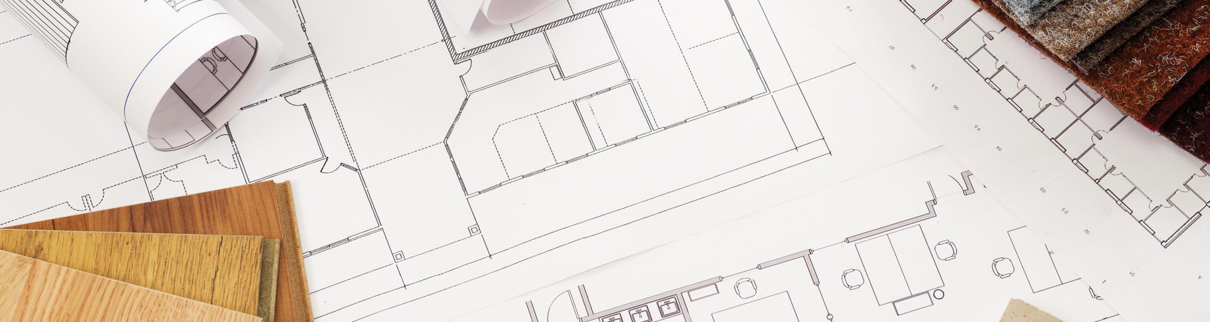 Construction plans spread on a table